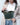 Woman wearing the Moon leather belt bag as a crossbody fanny pack – unisex and stylish for everyday use.